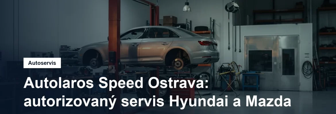 Servisní hala autorizovaného autoservisu v Ostravě, osobní vůz na zvedáku a vedle něj pracoviště karosářské dílny