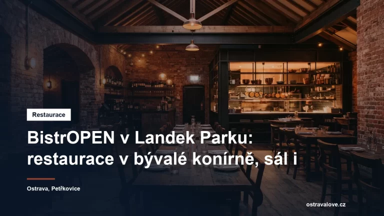 Interiér restaurace v rekonstruované historické cihlové budově s otevřenou kuchyní