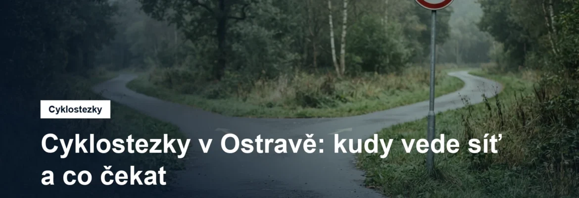 Rozdvojení cyklostezky s dopravní značkou a zeleným pásem