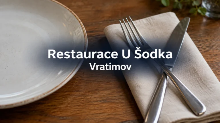Příbory a prázdný talíř s názvem Restaurace U Šodka Vratimov