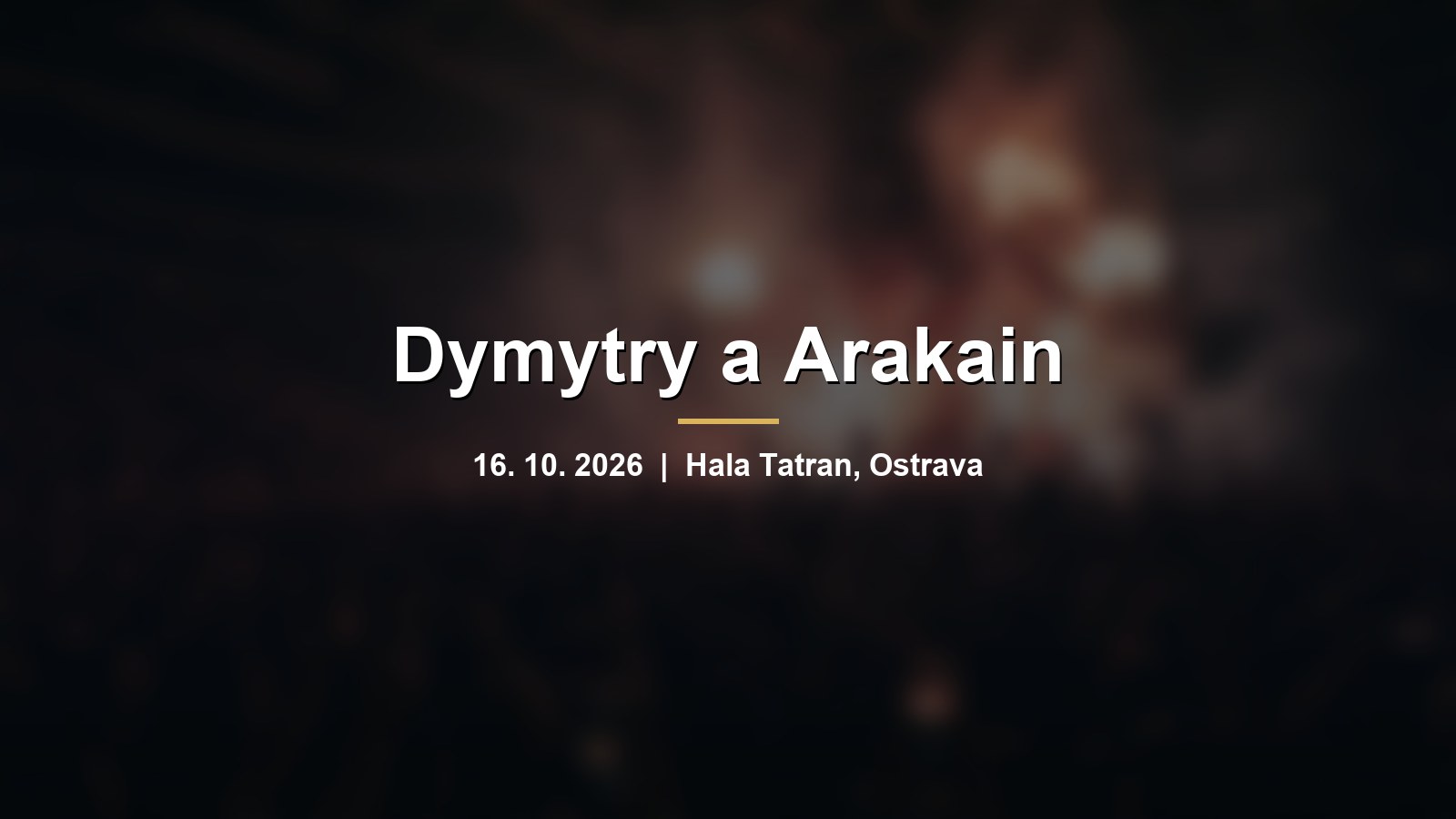 Rozmazaná koncertní hala s davem a červenými světly pódia s nápisem Dymytry a Arakain