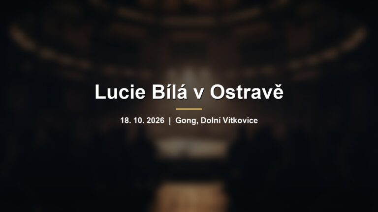 Rozmazaný koncertní sál s mikrofonem v teplém světle a nápisem Lucie Bílá v Ostravě