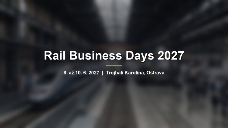 Rozmazaný moderní vlak v industriální hale s nápisem Rail Business Days 2027